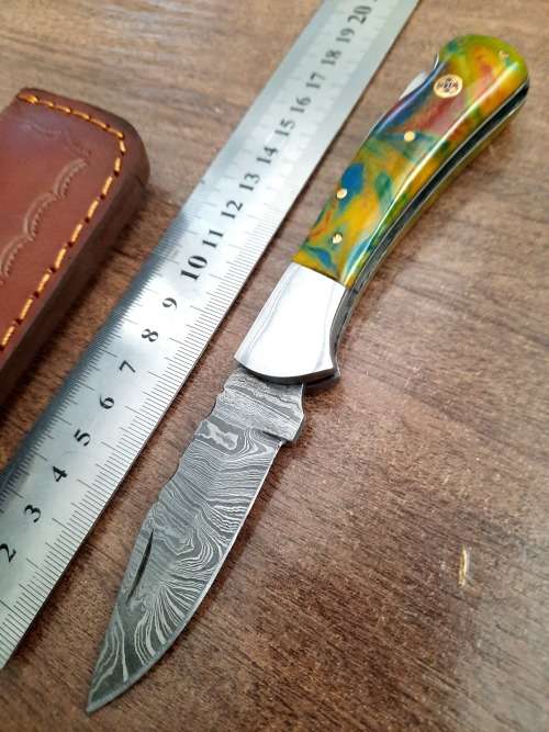 Handmade Damascus steel folding knife w Epoxy Handle Scales. New stock !!