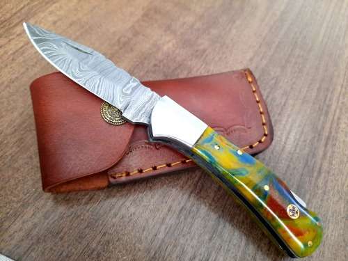 Handmade Damascus steel folding knife w Epoxy Handle Scales. New stock !!