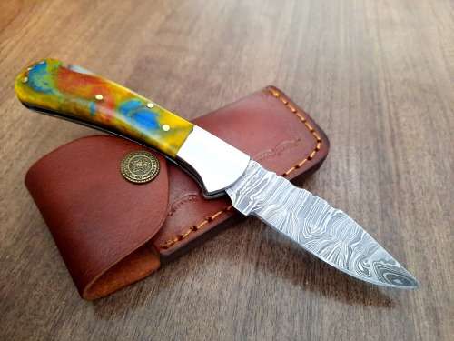 Handmade Damascus steel folding knife w Epoxy Handle Scales. New stock !!