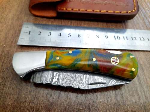 Handmade Damascus steel folding knife w Epoxy Handle Scales. New stock !!