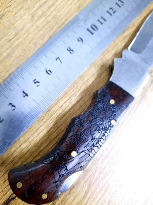 Handmade Damascus steel folding knife w Wooden Handle Scales. New stock !! Leather pouch is bad.