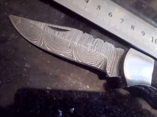 Handmade Damascus steel folding knife w Wooden Handle Scales. Pouch in bad shape, see pictures.