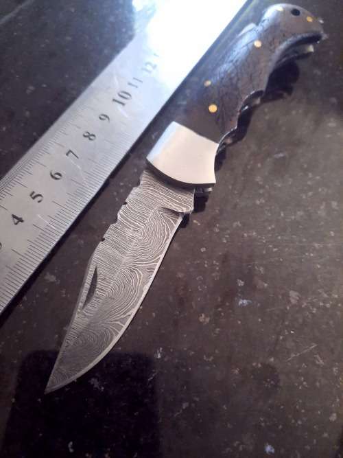 Handmade Damascus steel folding knife w Wooden Handle Scales. Pouch in bad shape, see pictures.