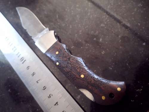 Handmade Damascus steel folding knife w Wooden Handle Scales. Pouch in bad shape, see pictures.