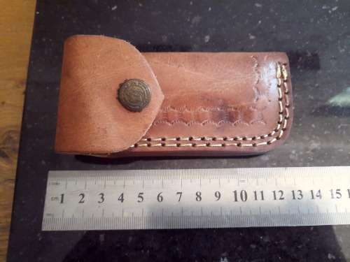 Handmade Damascus steel folding knife w Wooden Handle Scales. Pouch in bad shape, see pictures.