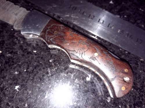 Handmade Damascus steel folding knife w Wooden Handle Scales. Pouch in bad shape, see pictures.