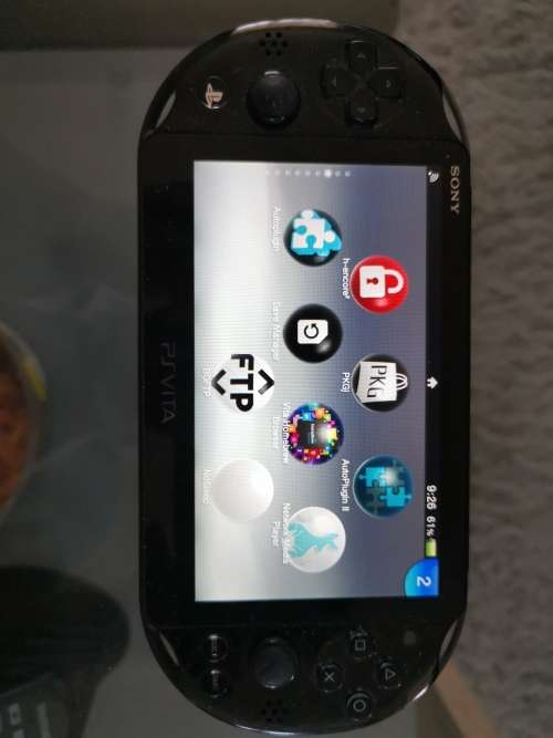 Ps vita slim with 32gig original card. Jailbroken on henkaku.