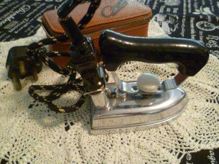 Omega Vintage travel iron in brown case