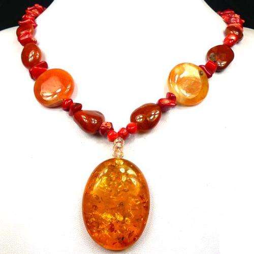 PRESSED AMBER,  CARNELIAN AND PURE CORAL NECKLACE, STONES USED ARE DIFFERENT SHAPES AND SIZES