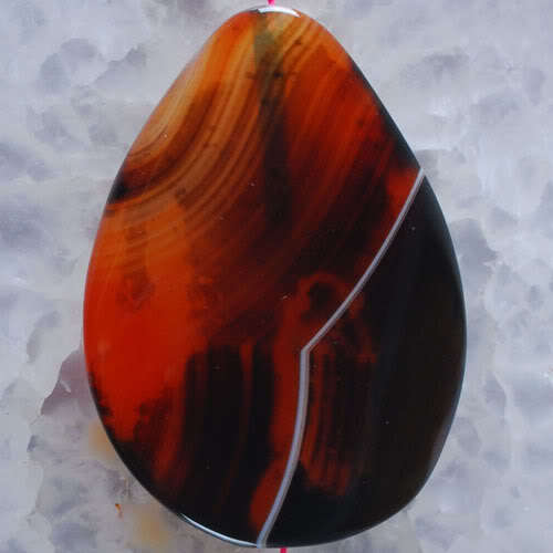 DREAM AGATE TEARDROP PENDANT  WITH A TWIST  41MM X 30MM X 6MM