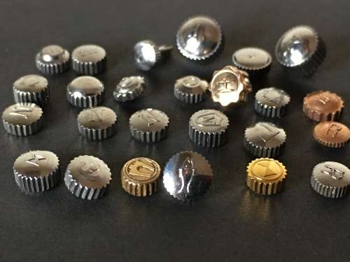 Assortment of 25 signed watch crowns