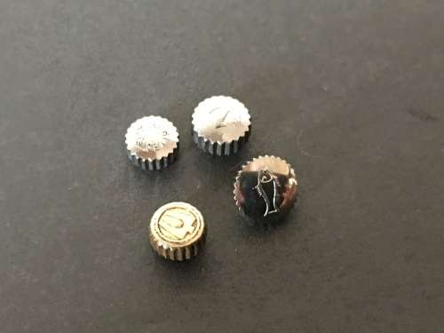 Assortment of 25 signed watch crowns