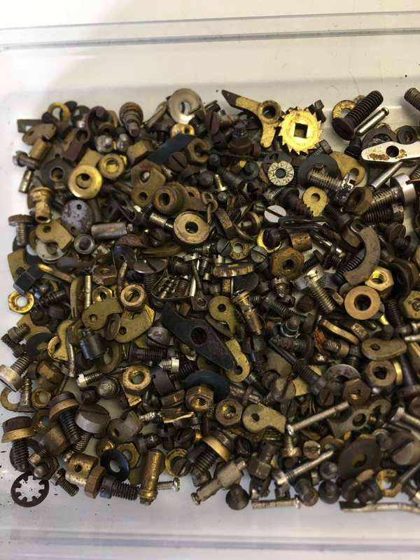 Old clock - screws - nuts - bolts - etc