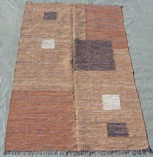 SERAFIAN'S CARPETS & RUGS: LEATHER CARPET