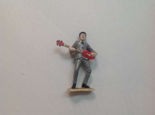 The Beatles LPs and set of figurines collection.