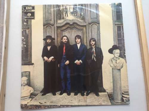 The Beatles LPs and set of figurines collection.