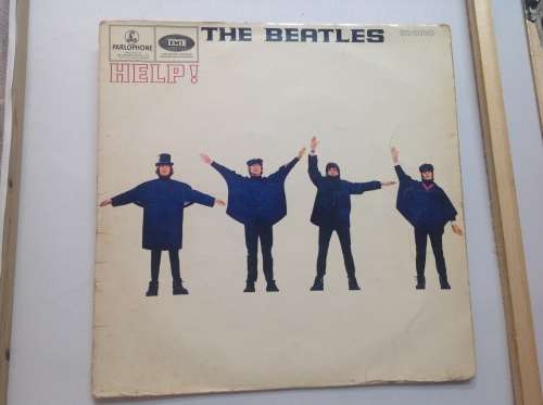 The Beatles LPs and set of figurines collection.
