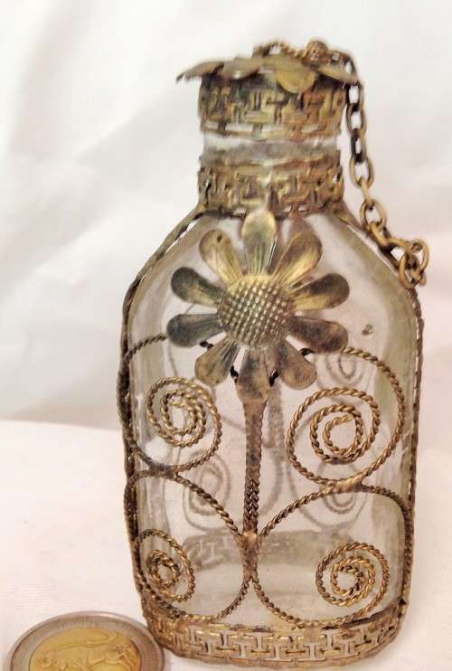 Perfume bottle decorated with Filigree style decor Gold tone metal Unusual