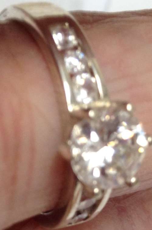 stamped 925 NV 9  * Sterling Nevada Silver mine size 9l  clear stone big middle each side 3 small