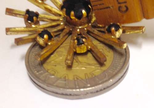 BROOCH-LARGE Sunburst dark Stone RED almost black Surrounded BY 8 smalll STONES- GOLD TONE METAL