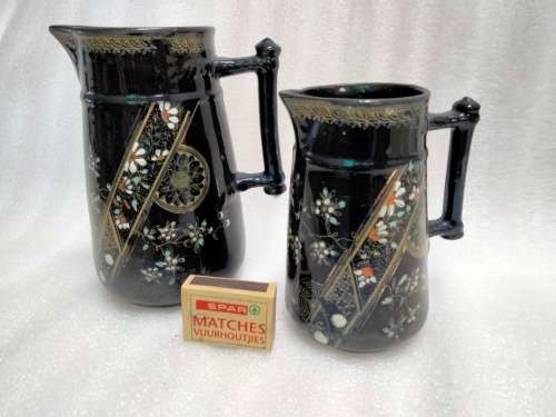 2 Graduating jugs ceramic larger one has been repaired Old