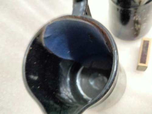 2 Graduating jugs ceramic larger one has been repaired Old