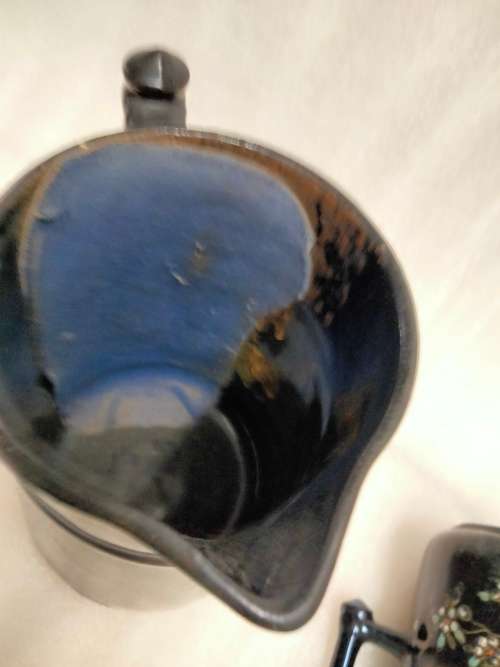 2 Graduating jugs ceramic larger one has been repaired Old