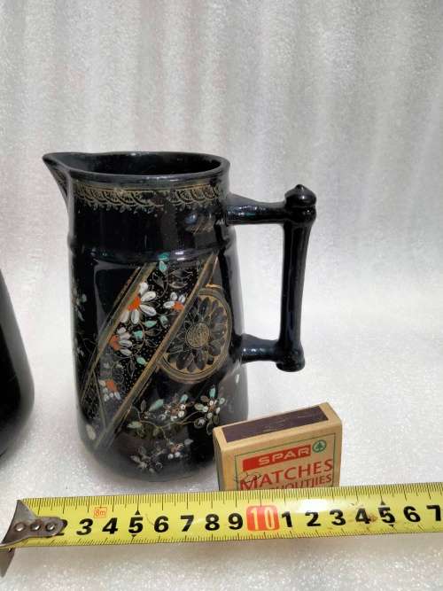 2 Graduating jugs ceramic larger one has been repaired Old