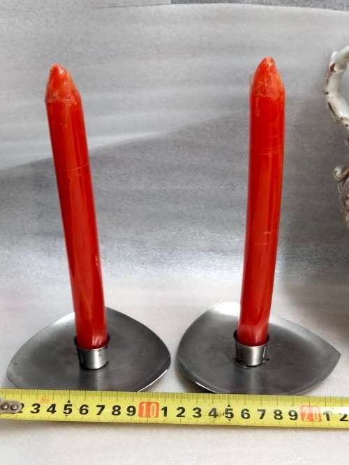 2 stainless steel candle holders and 2 red candles not used