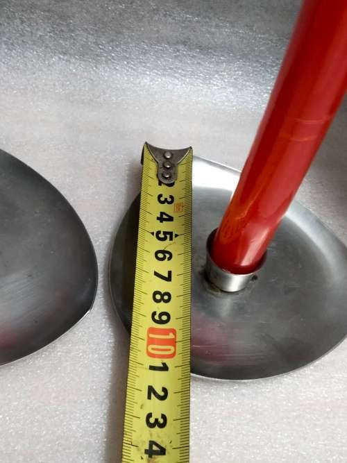 2 stainless steel candle holders and 2 red candles not used