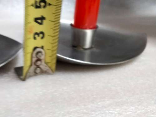 2 stainless steel candle holders and 2 red candles not used