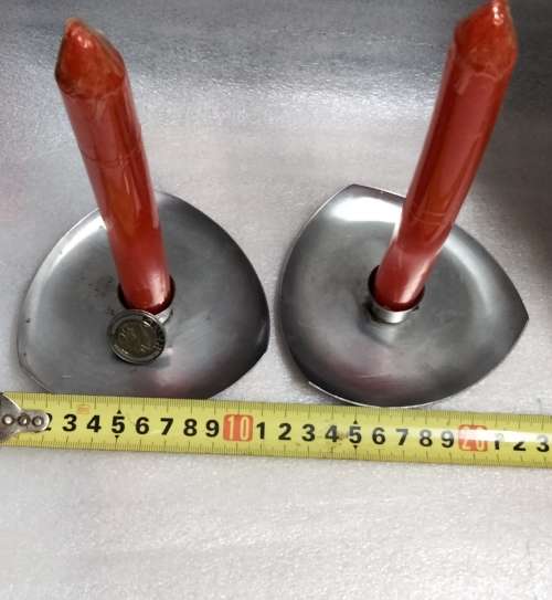 2 stainless steel candle holders and 2 red candles not used
