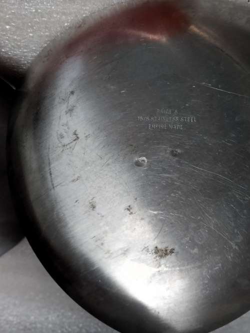 2 stainless steel candle holders and 2 red candles not used