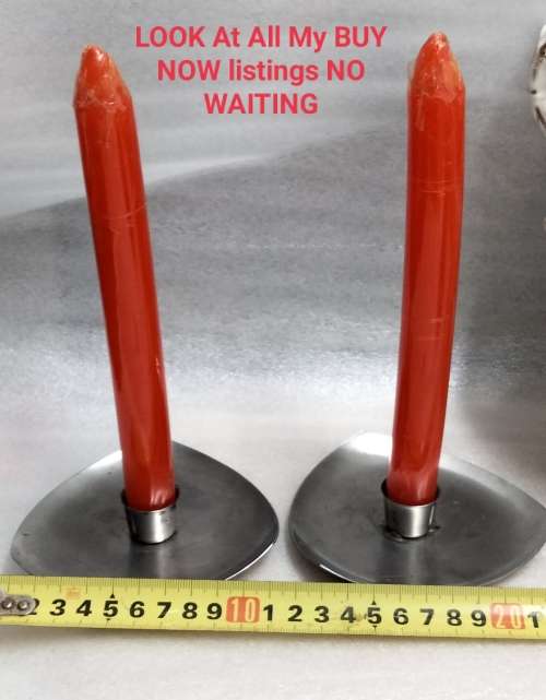 2 stainless steel candle holders and 2 red candles not used