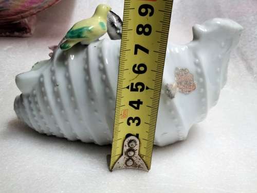 Ornament Porcelain white shell shape vase has figurine of 2 sea gulls and 2 roses