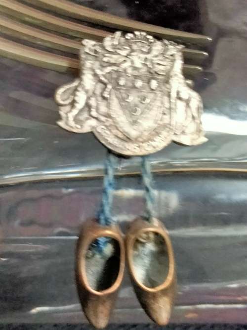 Circa 1960`sBROOCH GRAHAMSTOWN Coat of Arms 2 Dangling clogs charms made in HOLLAND