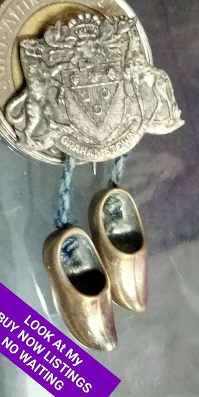 Circa 1960`sBROOCH GRAHAMSTOWN Coat of Arms 2 Dangling clogs charms made in HOLLAND