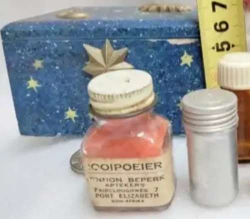 Bottle Rooipoier still some in box small tin bottle