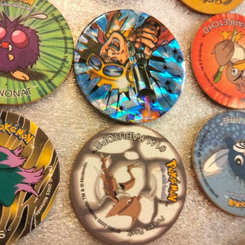 7 Pokémon Tazos + 1 other from another collection to yours