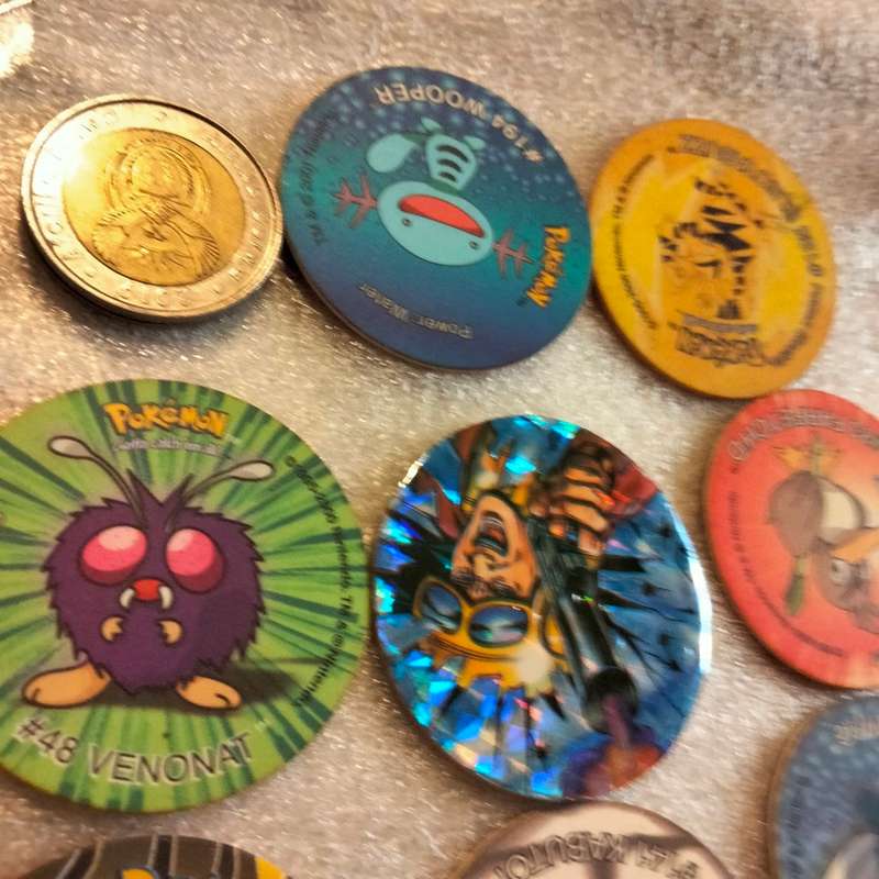 7 Pokémon Tazos + 1 other from another collection to yours