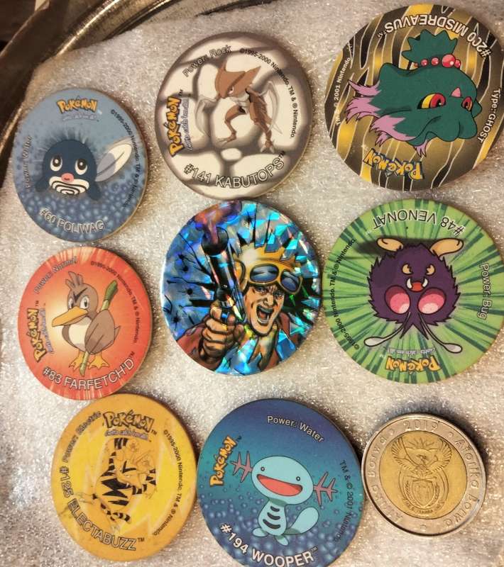 7 Pokémon Tazos + 1 other from another collection to yours