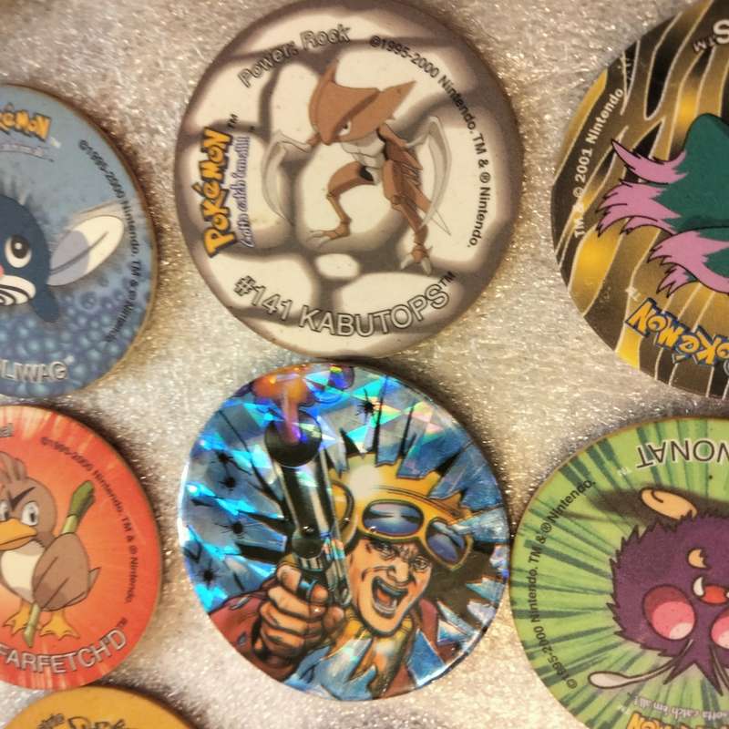 7 Pokémon Tazos + 1 other from another collection to yours