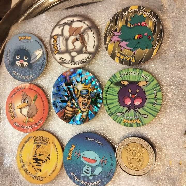 7 Pokémon Tazos + 1 other from another collection to yours