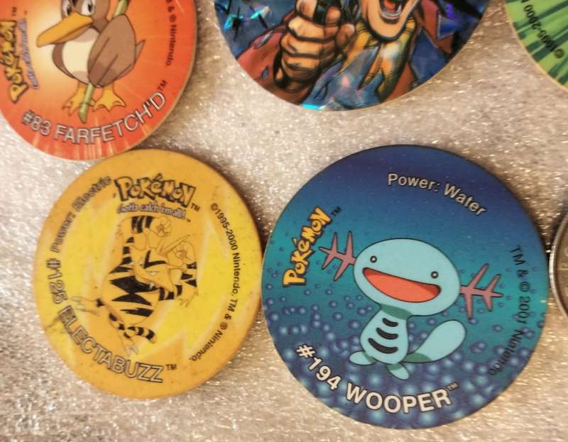 7 Pokémon Tazos + 1 other from another collection to yours