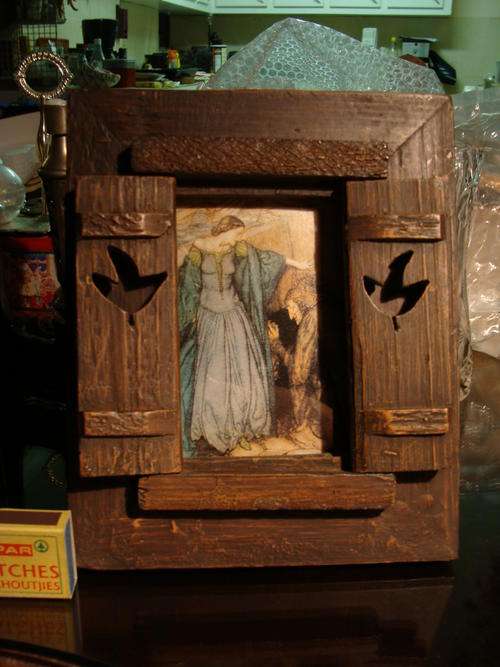 WOODEN PICTURE FRAME HAS 2 OPENING DOORS WITH  POST -ROMANTICISM PRINT behind glass