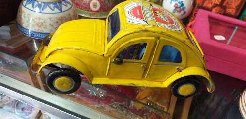 Yellow Heinekin VW Beetle Tin Car imported from Madagascar