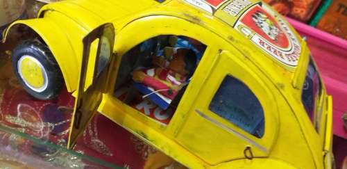 Yellow Heinekin VW Beetle Tin Car imported from Madagascar