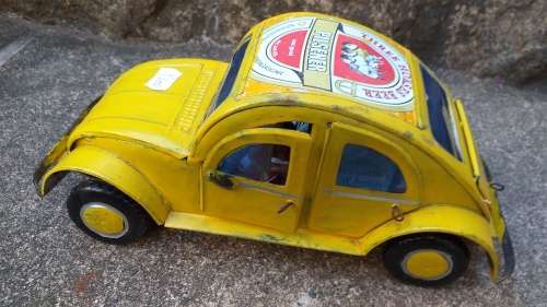 Yellow Heinekin VW Beetle Tin Car imported from Madagascar