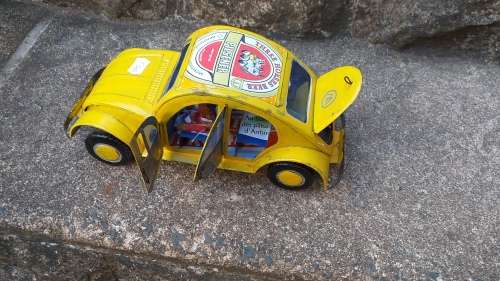 Yellow Heinekin VW Beetle Tin Car imported from Madagascar