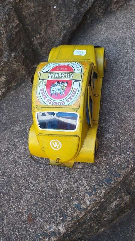 Yellow Heinekin VW Beetle Tin Car imported from Madagascar